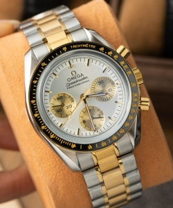 omega speedmaster moonwatch chronogarph demi gold 42mm