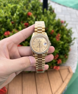 Rolex day-date diamond bezel champagne dial 40mm