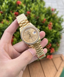 Rolex day-date diamond bezel champagne dial 40mm