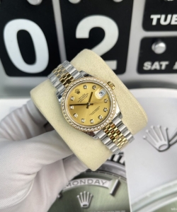 Rolex datejust women’s with stone bezel champagne dial 31mm