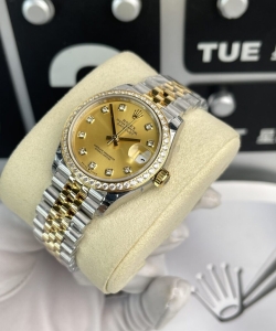 Rolex datejust women’s with stone bezel champagne dial 31mm