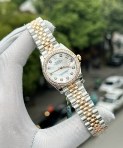 Rolex datejust mother of pearl dial with stone bezel 31mm