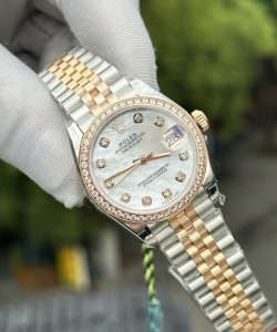 Rolex datejust mother of pearl dial with stone bezel 31mm