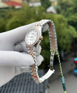 Rolex datejust mother of pearl dial with stone bezel 31mm